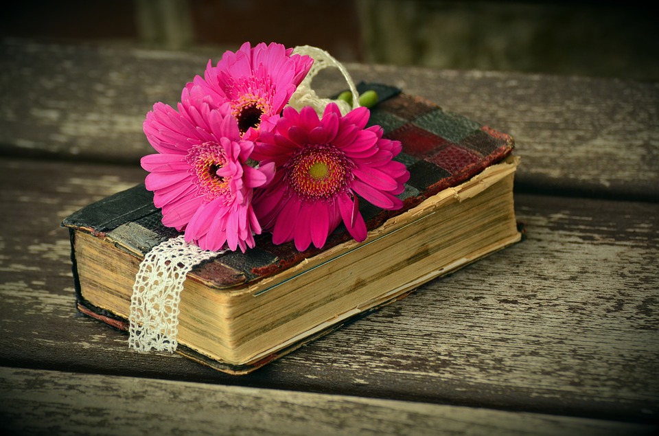 A picture of a Bible with flowers on it