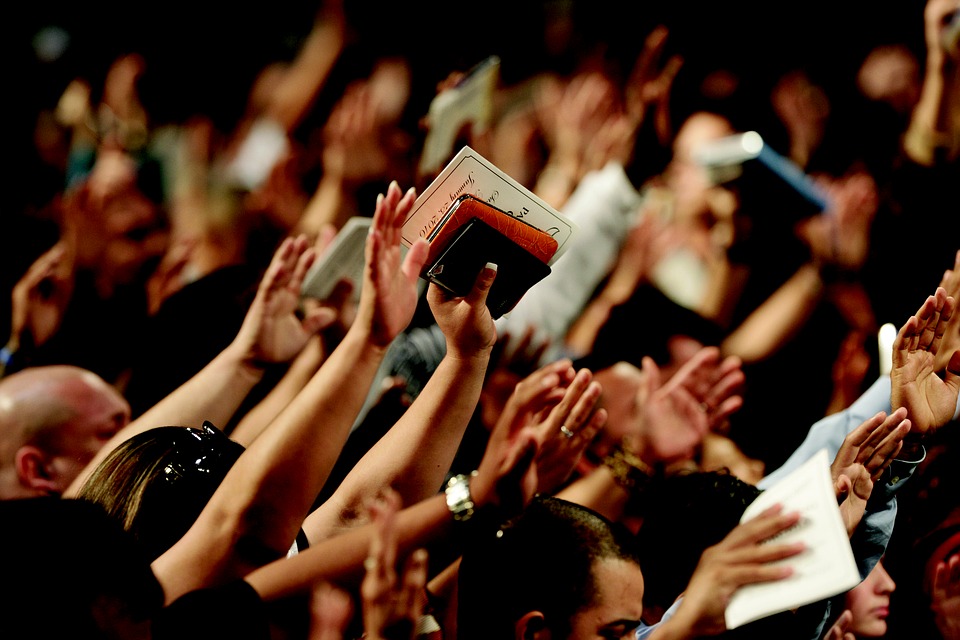 A picture of hands raised in worship